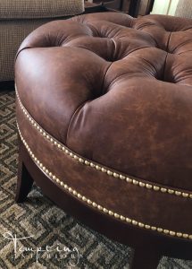 leather ottoman with nailheads with logo